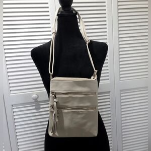 Cream Crossbody Bag with Multiple Zippers